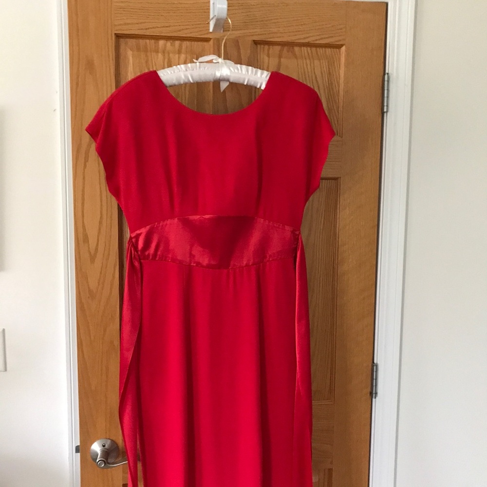 Red dress with satin sash that ties around back.